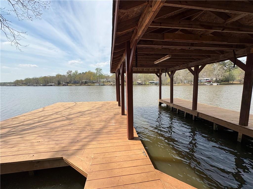 139 Bear Creek Road Eatonton, GA 31024 - Photo 7 of 8 a view of a balcony with wooden floor and lake view