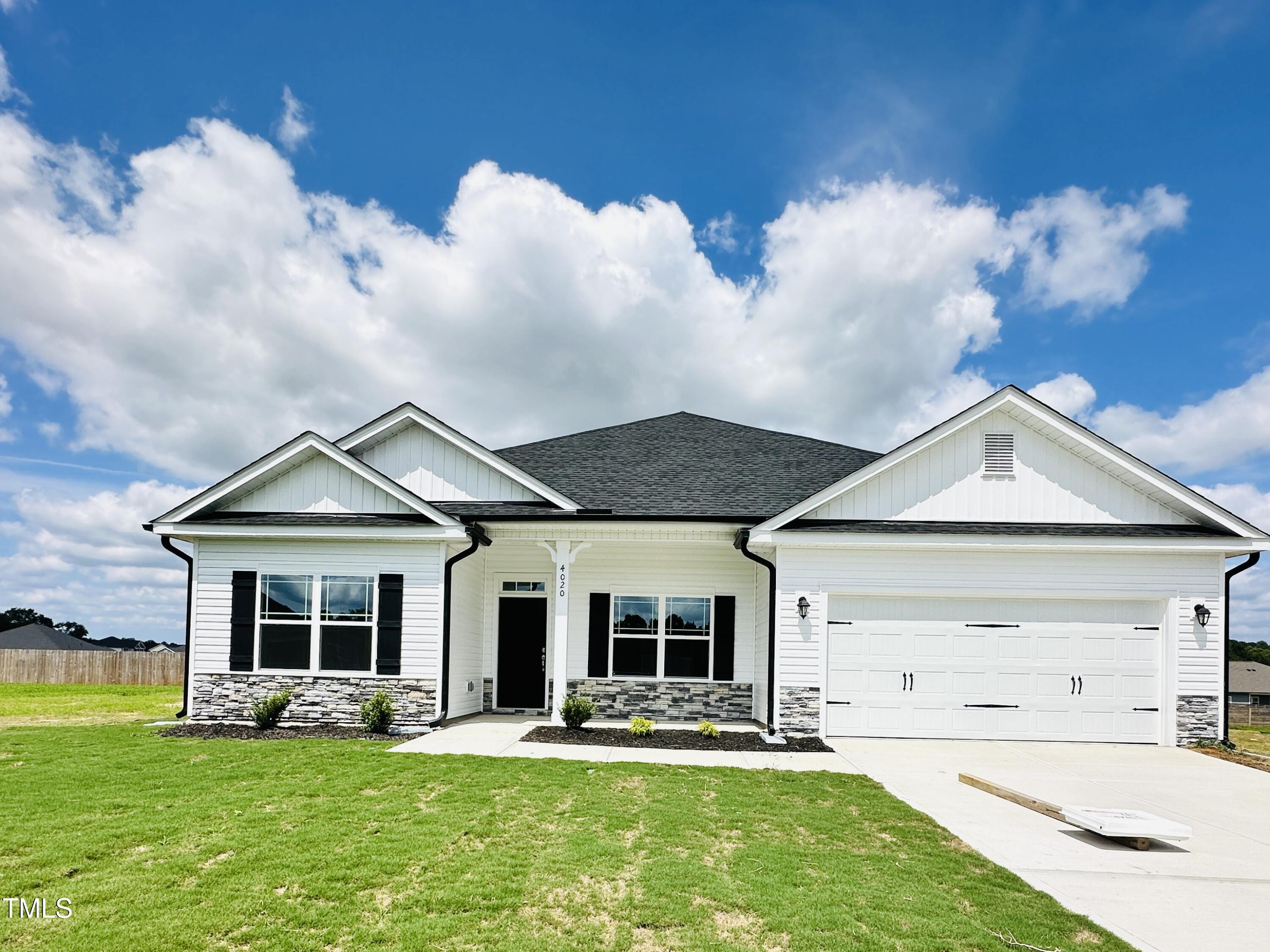 4020 Fletcher Road Bailey, NC 27807 - Photo 1 of 30 a front view of a house with a yard and trees