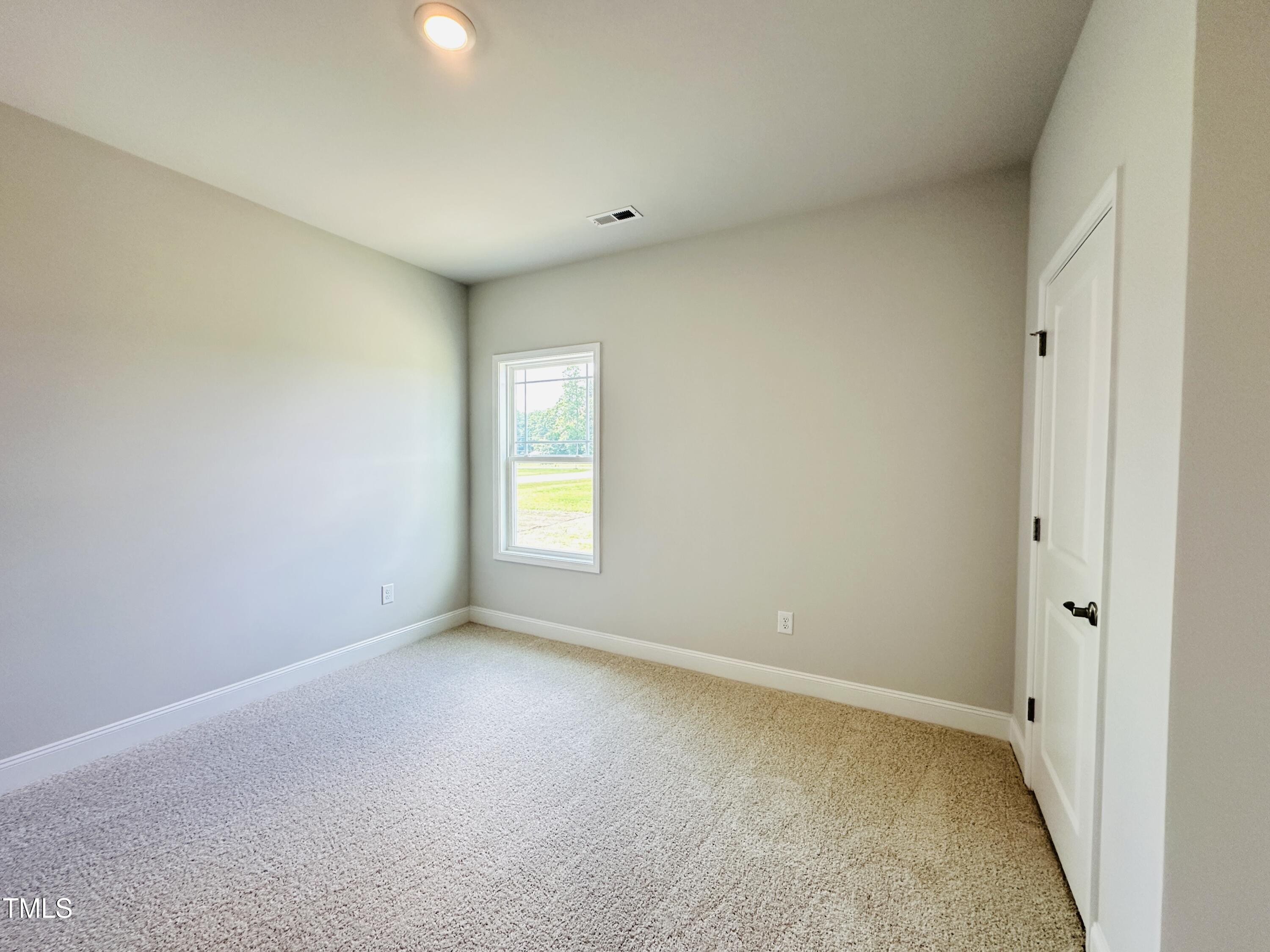 4020 Fletcher Road Bailey, NC 27807 - Photo 13 of 30 an empty room with a window