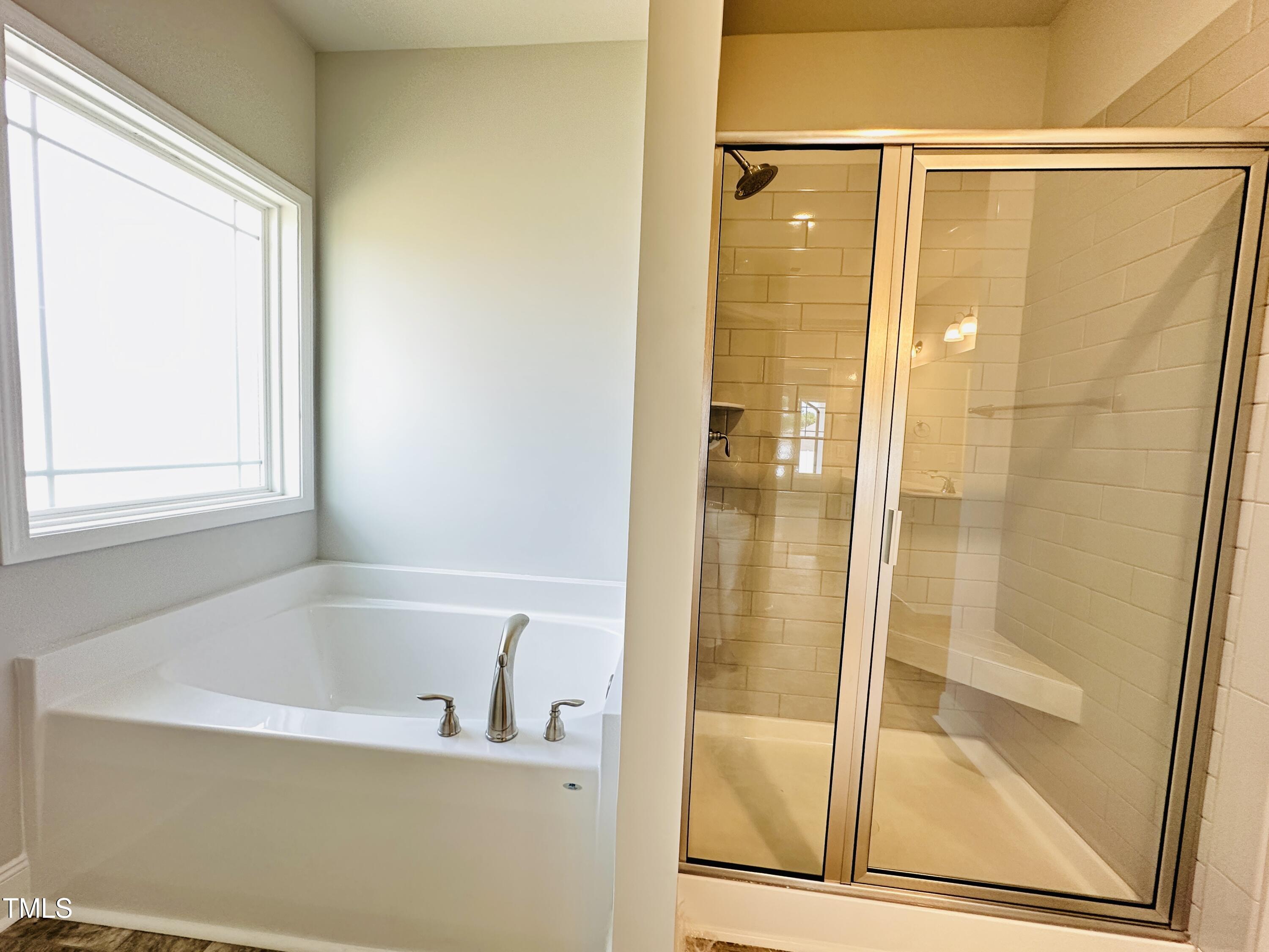 4020 Fletcher Road Bailey, NC 27807 - Photo 18 of 30 a bathroom with a bathtub and a shower