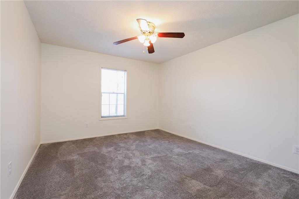 208 Natchez Trace Sandy Springs, GA 30350 - Photo 13 of 15 wooden floor in an empty room with a window