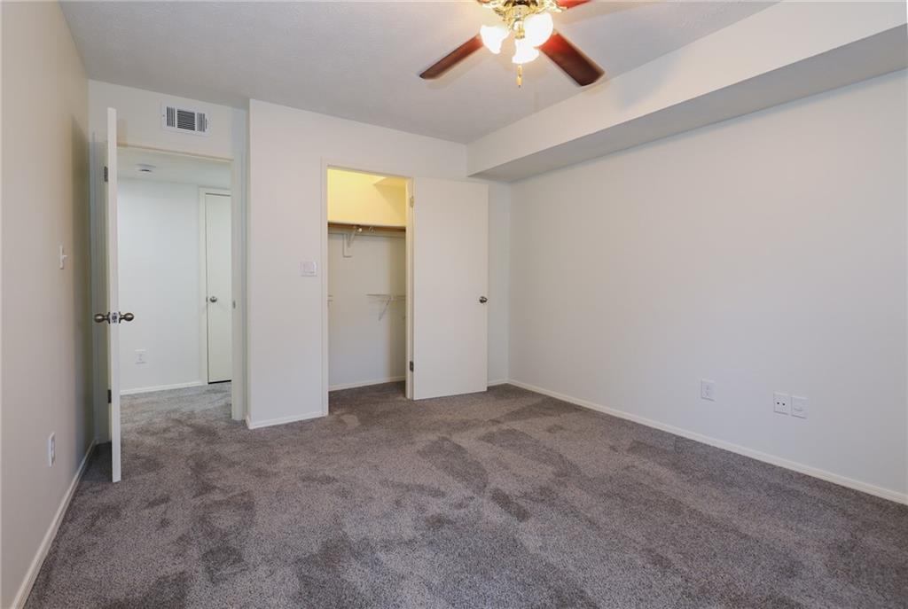 208 Natchez Trace Sandy Springs, GA 30350 - Photo 10 of 15 an empty room with fan and entrance