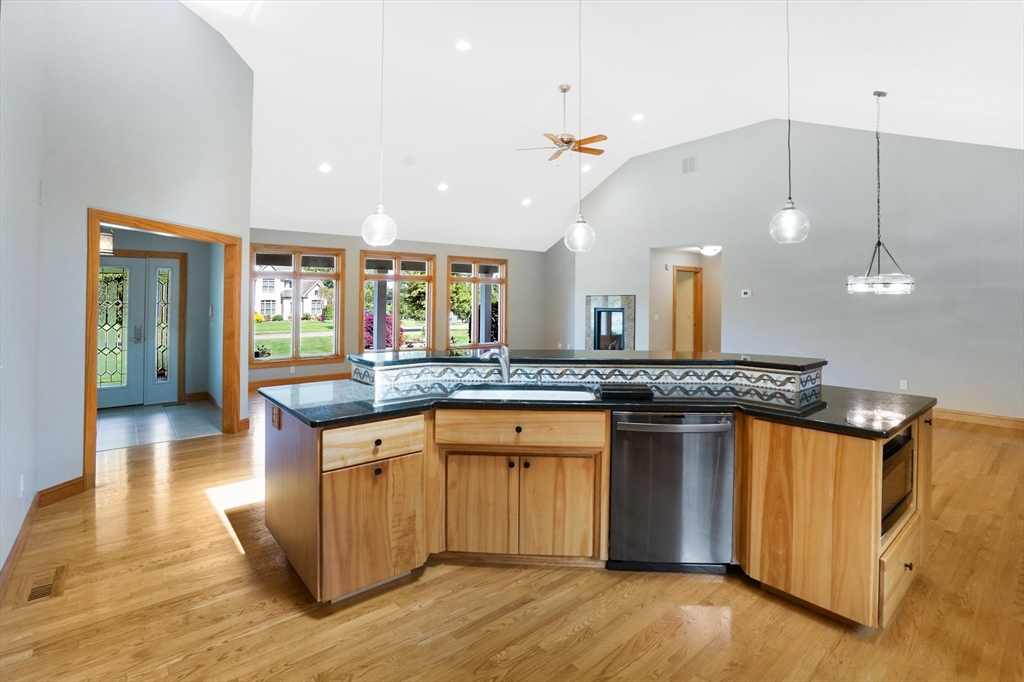 89 Nottingham Drive East Longmeadow, MA 01028 - Photo 11 of 40 an open kitchen with a sink and chandelier