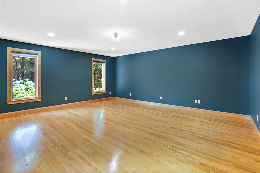 89 Nottingham Drive East Longmeadow, MA 01028 - Photo 17 of 40 a view of an empty room with wooden floor and a window