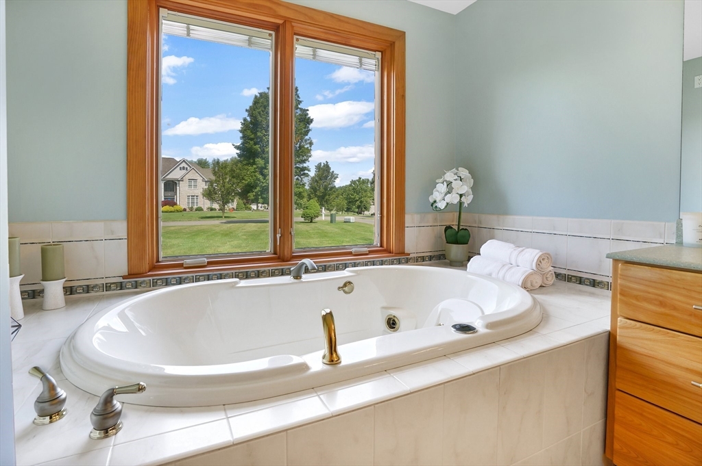 89 Nottingham Drive East Longmeadow, MA 01028 - Photo 20 of 40 a bathroom with a tub and large window