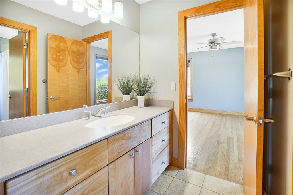 89 Nottingham Drive East Longmeadow, MA 01028 - Photo 27 of 40 a bathroom with a granite countertop sink and a mirror