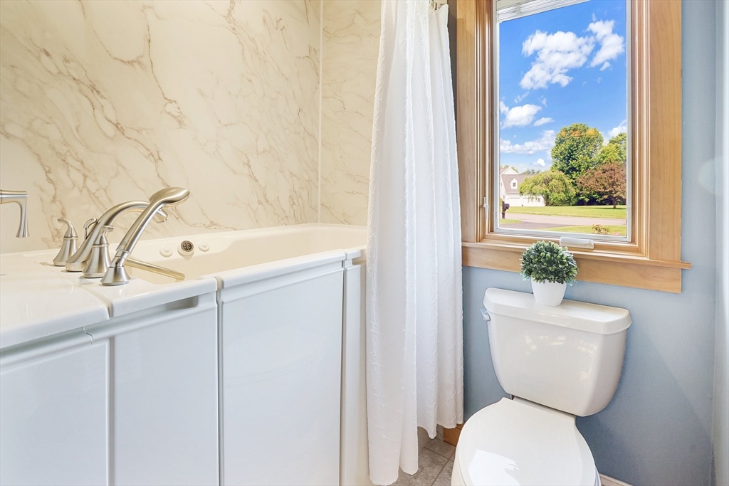 89 Nottingham Drive East Longmeadow, MA 01028 - Photo 28 of 40 a bathroom with a toilet a sink and a bathtub