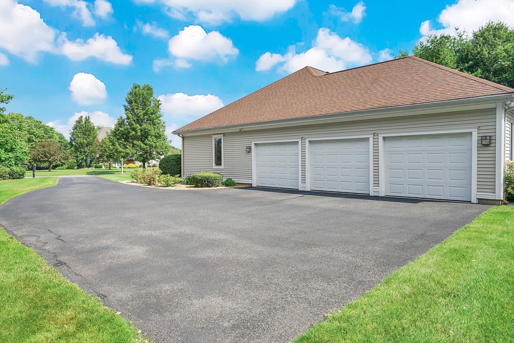89 Nottingham Drive East Longmeadow, MA 01028 - Photo 3 of 40 a front view of a house with a yard and garage