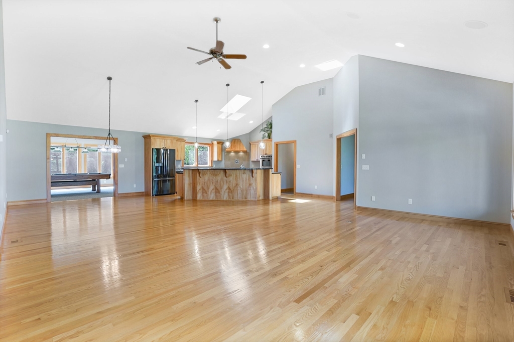 89 Nottingham Drive East Longmeadow, MA 01028 - Photo 7 of 40 a view of a room with wooden floor ceiling fan and window