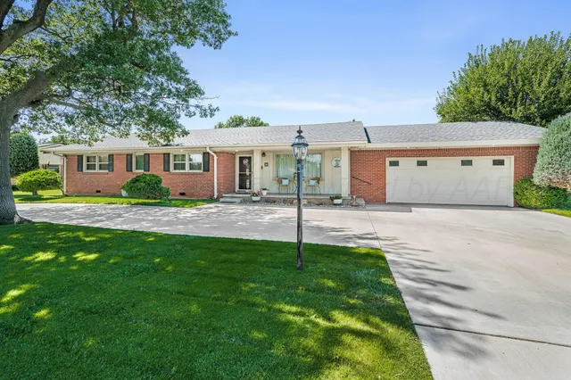 a house view with a garden space