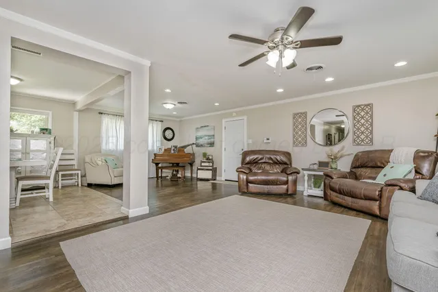 a living room with furniture and a table