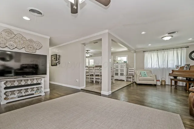 a view of a livingroom with furniture and a flat screen tv