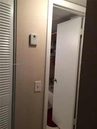 a bathroom with a sink vanity and mirror