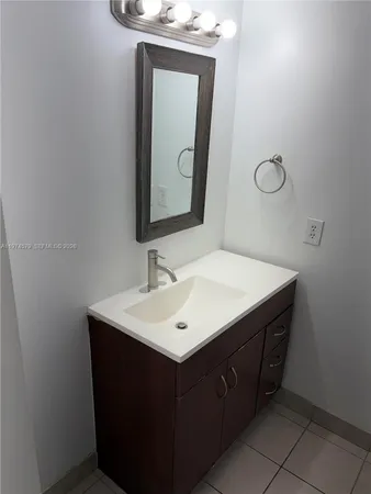 a white toilet sitting next to a shower curtain