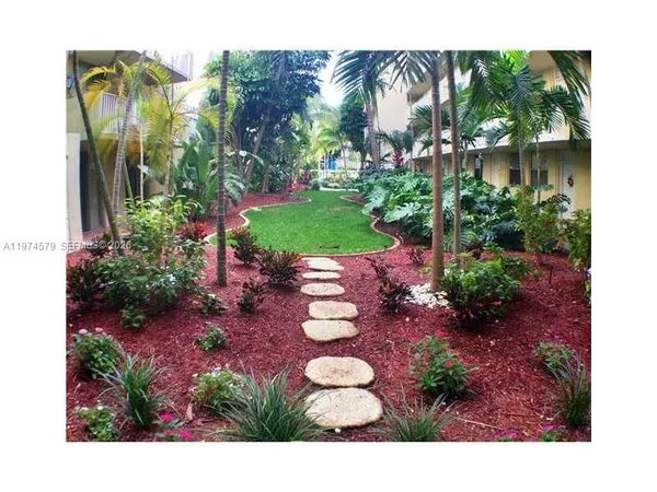 a view of an empty room and a window