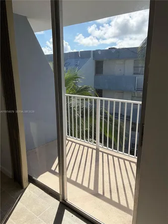 a view of a kitchen with a sink cabinets and a window