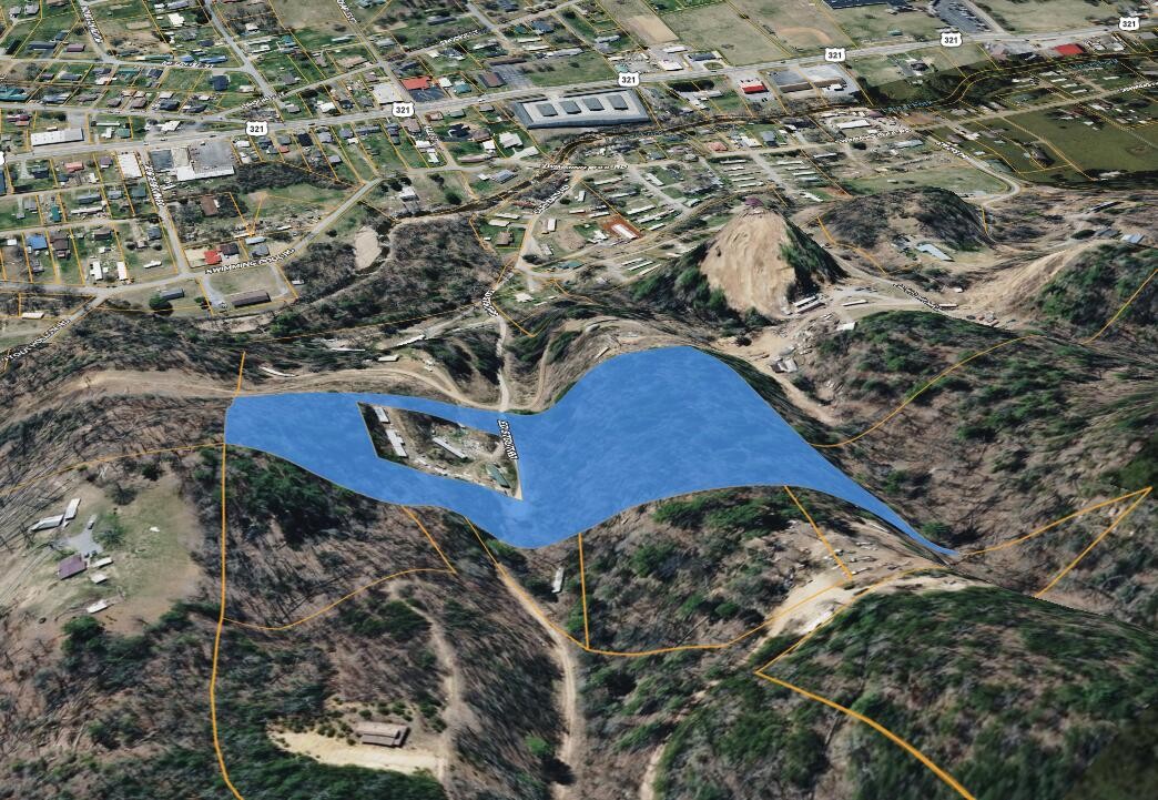 122 Ed Stout Road Hampton, TN 37658 - Photo 4 of 6 a view of outdoor space with signage and flags