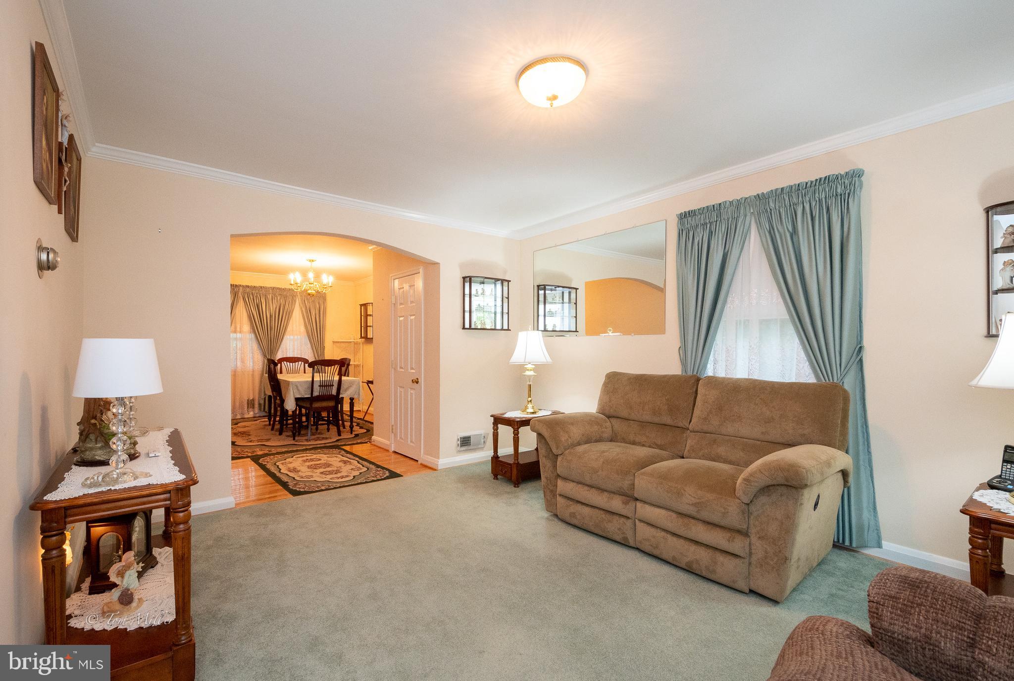 8329 Kendale Road Baltimore, MD 21234 - Photo 4 of 35 Spacious Living Room with Hardwoods under Carpet.
