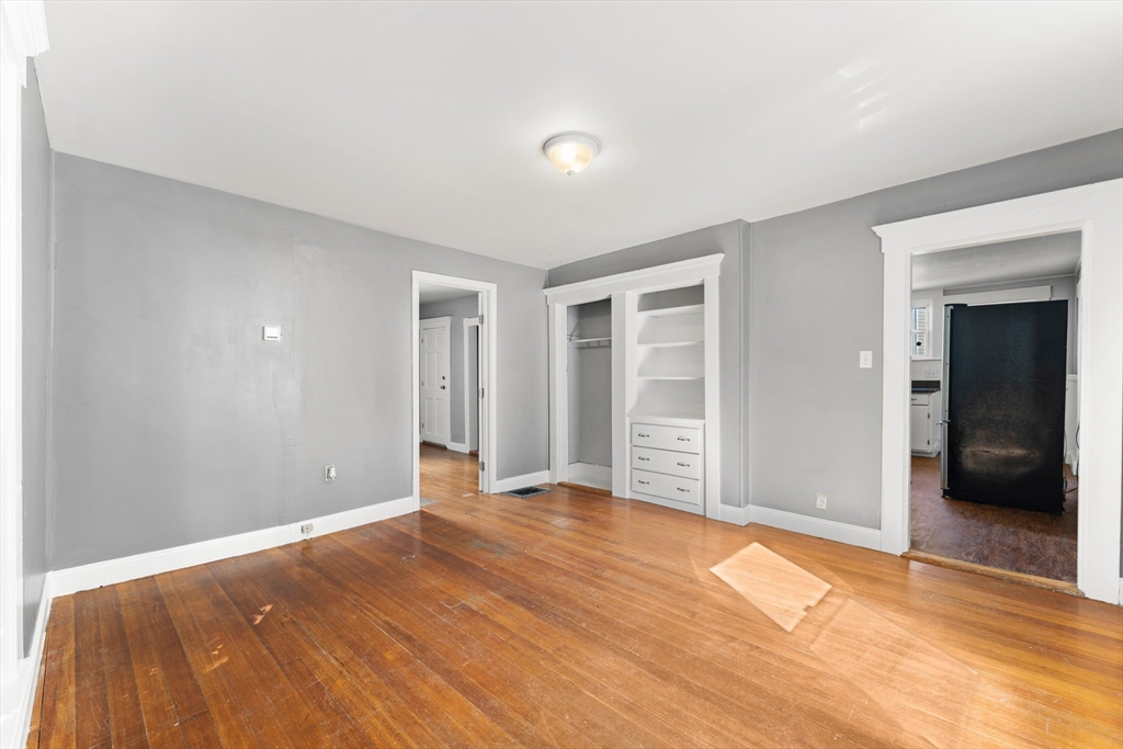 211 Burrill Street Swampscott, MA 01907 - Photo 14 of 39 a view of an empty room with wooden floor