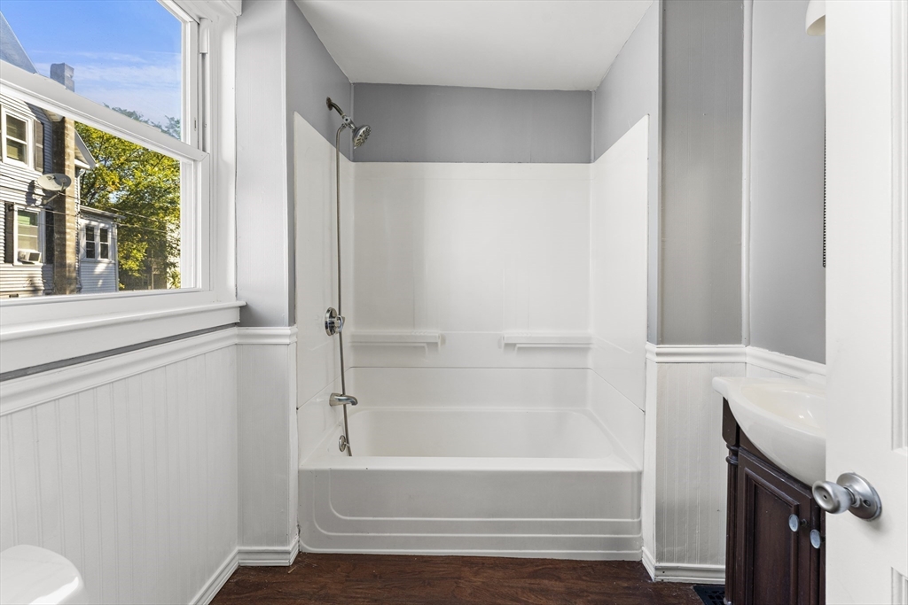 211 Burrill Street Swampscott, MA 01907 - Photo 17 of 39 a bathroom with a bathtub and a shower