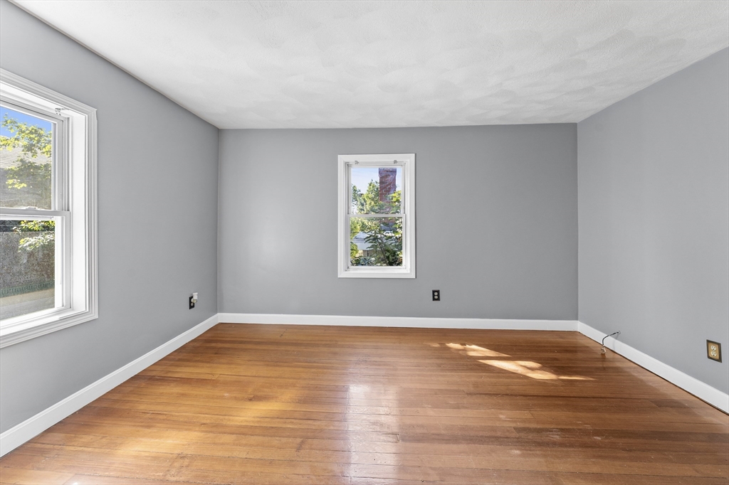 211 Burrill Street Swampscott, MA 01907 - Photo 27 of 39 a view of empty room with wooden floor and fan
