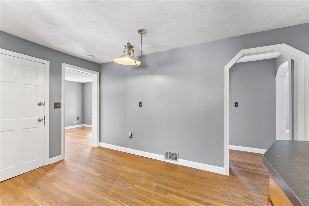 211 Burrill Street Swampscott, MA 01907 - Photo 28 of 39 a view of an empty room with wooden floor and a window