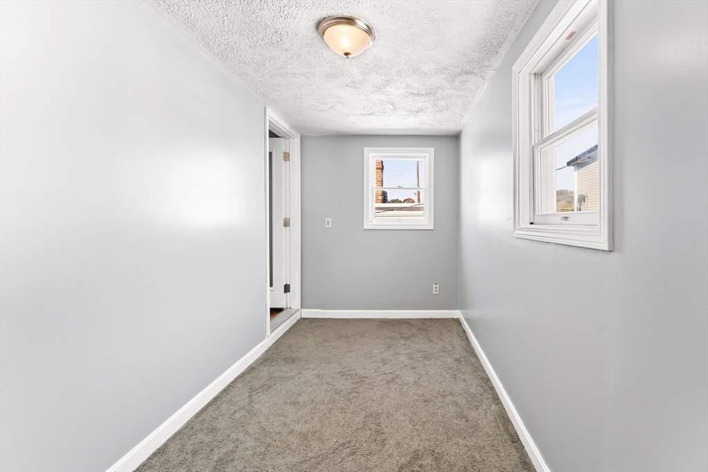 211 Burrill Street Swampscott, MA 01907 - Photo 32 of 39 an empty room with windows