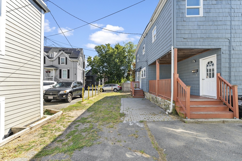 211 Burrill Street Swampscott, MA 01907 - Photo 35 of 39 a view of a house with a yard and pathway