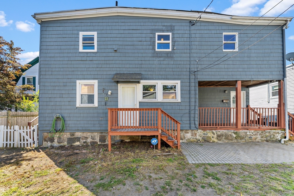211 Burrill Street Swampscott, MA 01907 - Photo 36 of 39 a front view of a house with a yard