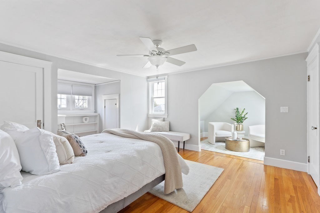 1097 Greendale Avenue Needham, MA 02492 - Photo 22 of 36 a spacious bedroom with a bed a dresser and wooden floor