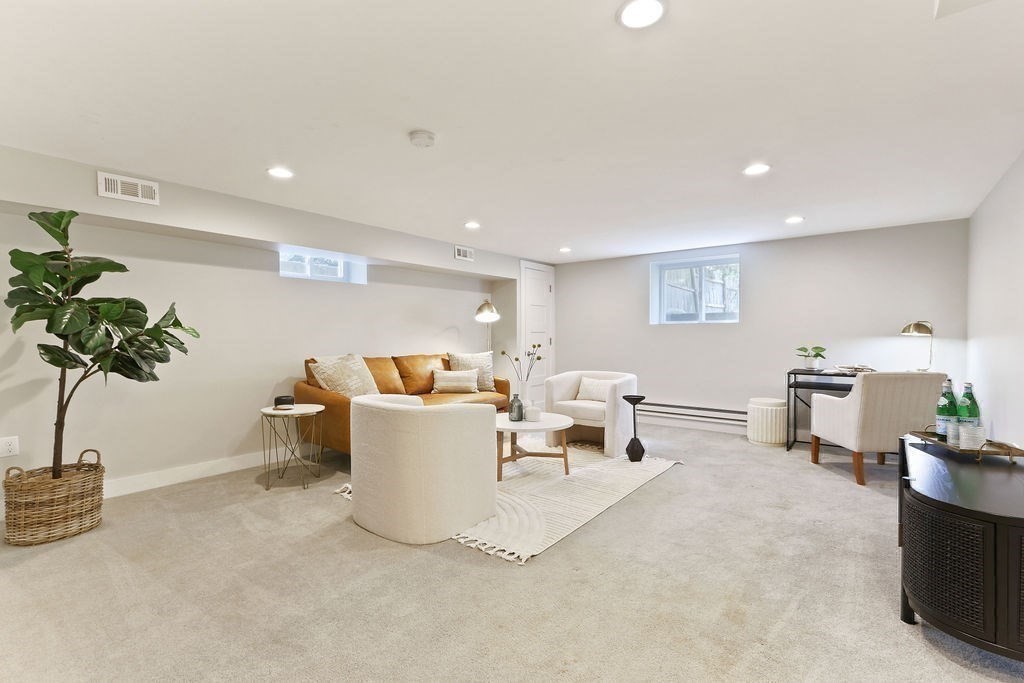 1097 Greendale Avenue Needham, MA 02492 - Photo 28 of 36 a living room with furniture and potted plant