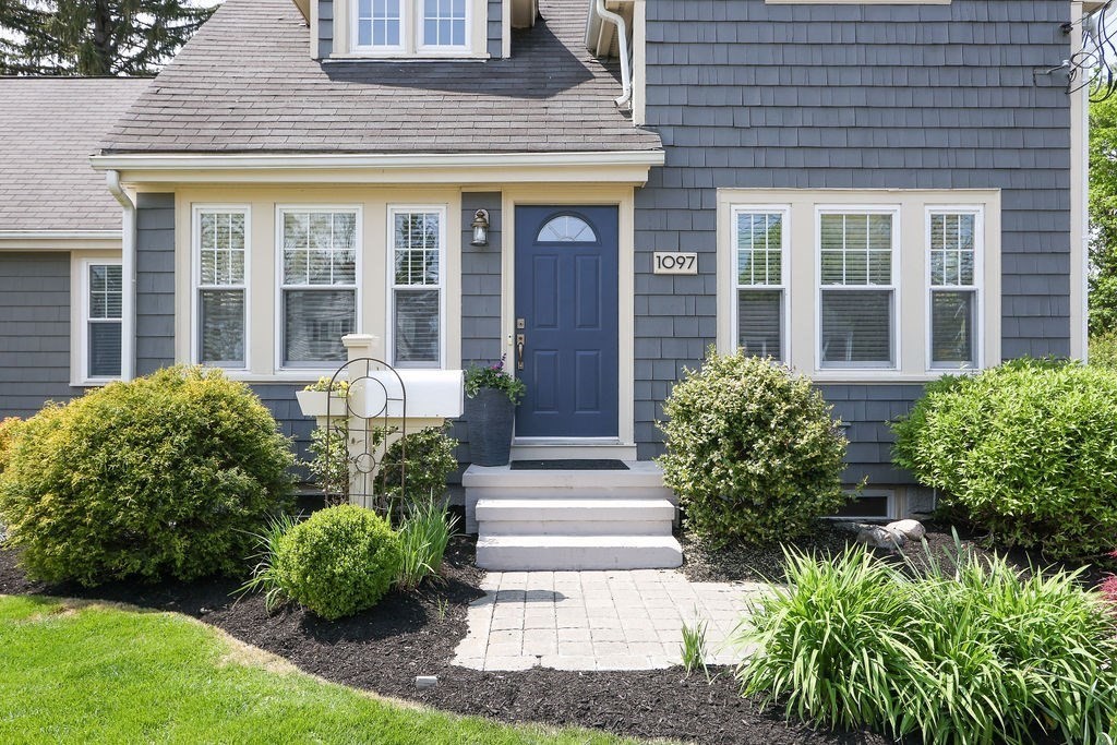 1097 Greendale Avenue Needham, MA 02492 - Photo 3 of 36 a front view of a house with garden