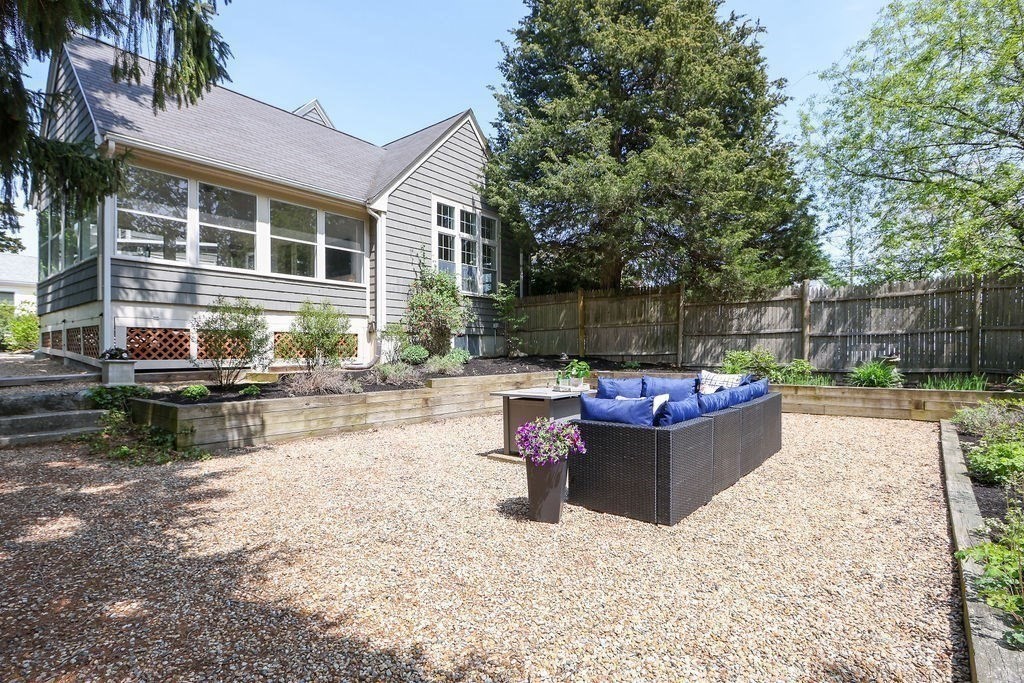 1097 Greendale Avenue Needham, MA 02492 - Photo 31 of 36 a view of a patio with couches chairs and a fire pit