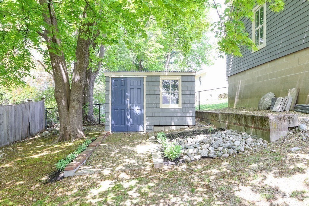 1097 Greendale Avenue Needham, MA 02492 - Photo 35 of 36 a view of a backyard with a tree