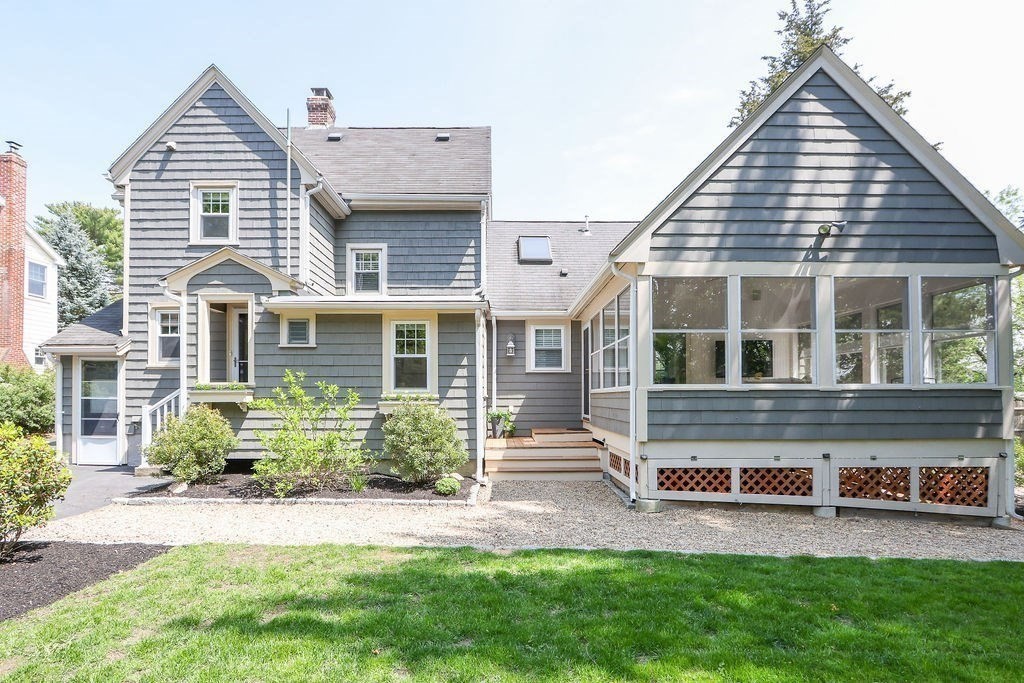 1097 Greendale Avenue Needham, MA 02492 - Photo 36 of 36 a front view of a house with a yard and potted plants