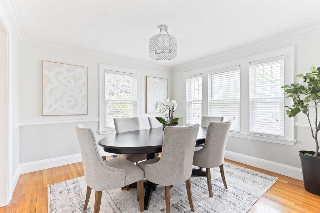 1097 Greendale Avenue Needham, MA 02492 - Photo 9 of 36 a view of a dining room with furniture window and wooden floor
