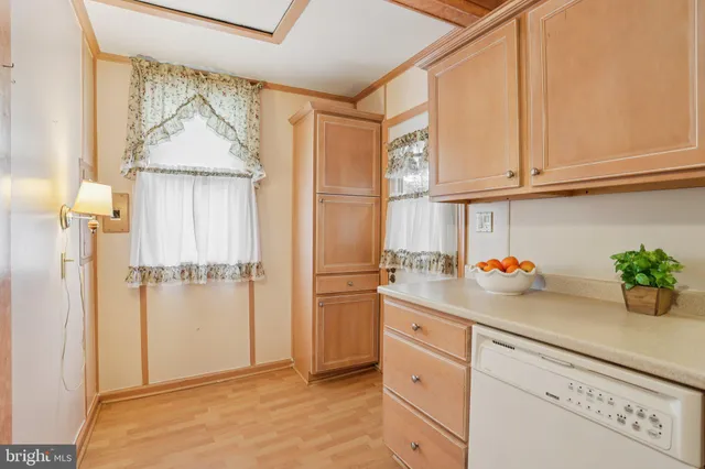 a kitchen with a refrigerator and cabinets