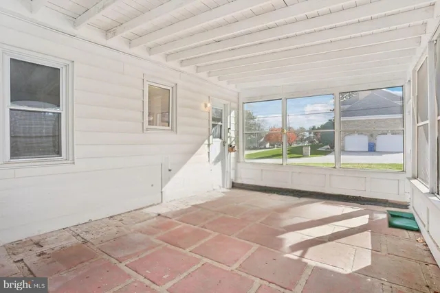 a view of an empty room with a balcony