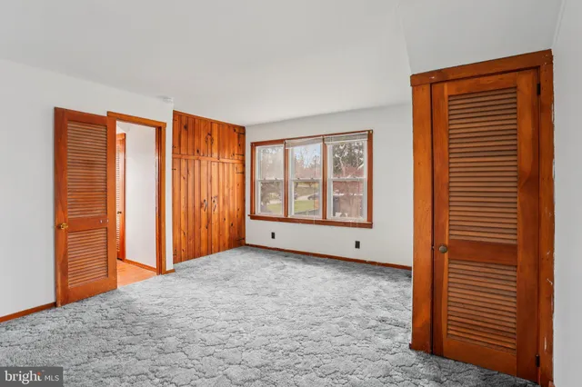 a view of an empty room with windows