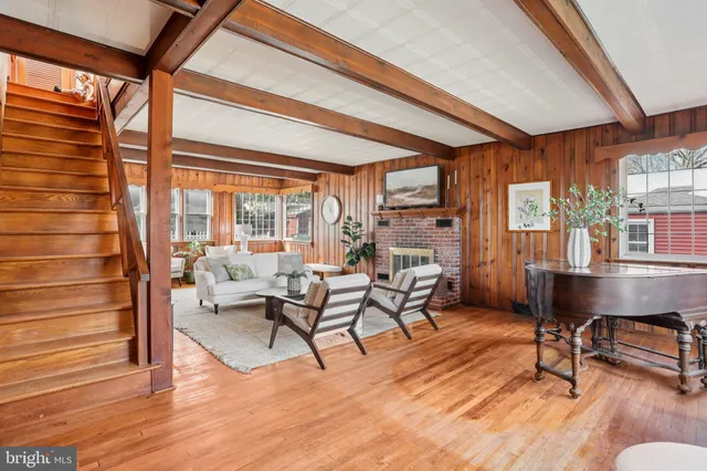 a work room with furniture and a wooden floor