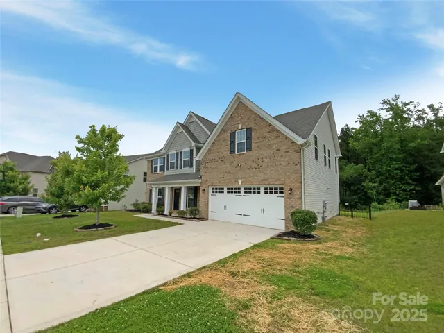 a view of a field with trees in the background
