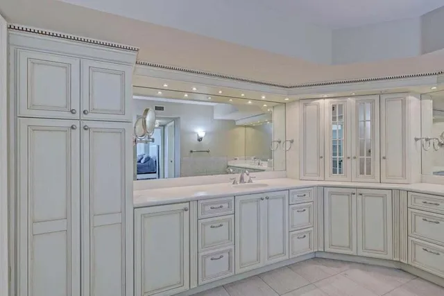 a bathroom with a double vanity sink and mirror