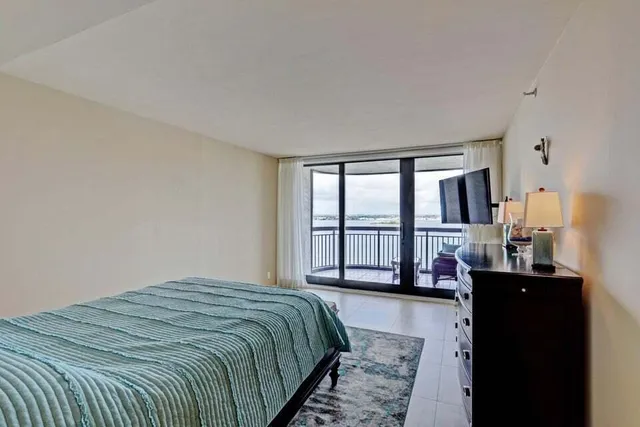 a bedroom with a bed and a closet with lamp