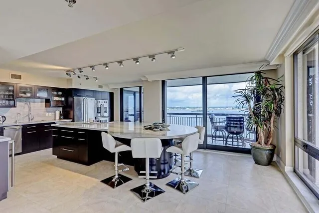 a view of a dining room with furniture window and outside view