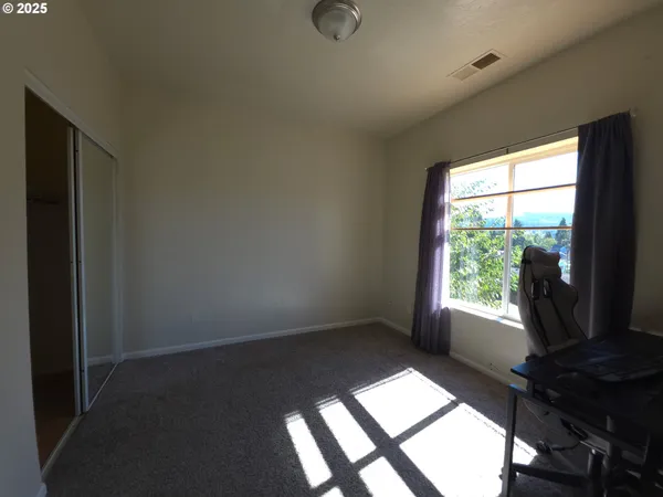 a view of an empty room and window