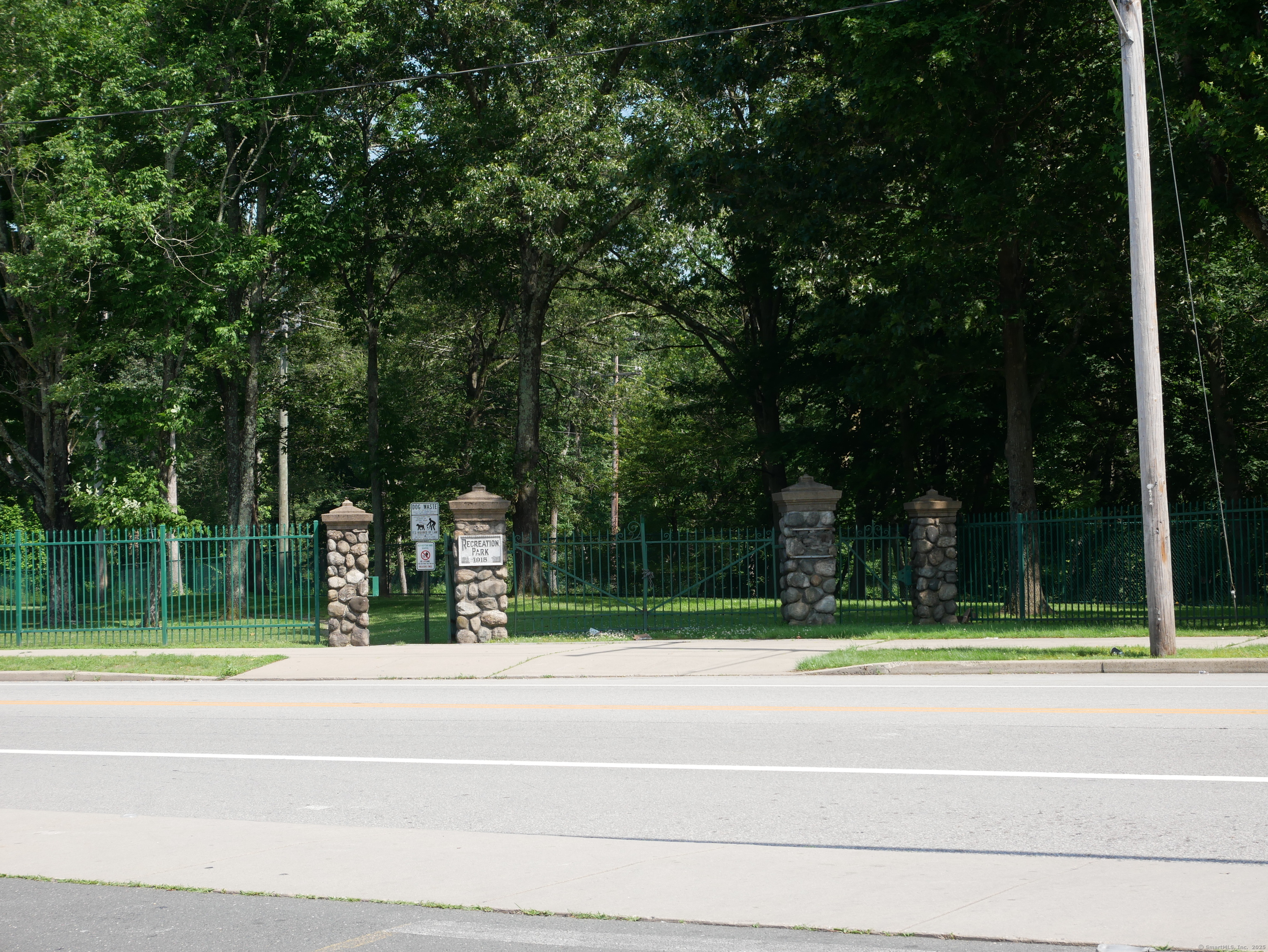 38 Elm Street Windham, CT 06226 - Photo 5 of 9 a view of a house with a backyard and a trees