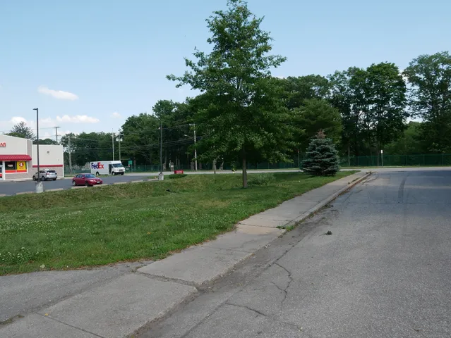 a childrens park with lots of swings and slides