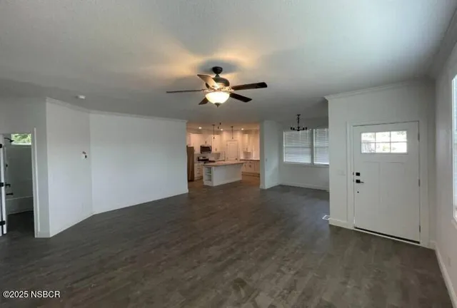 a view of an empty room with a window