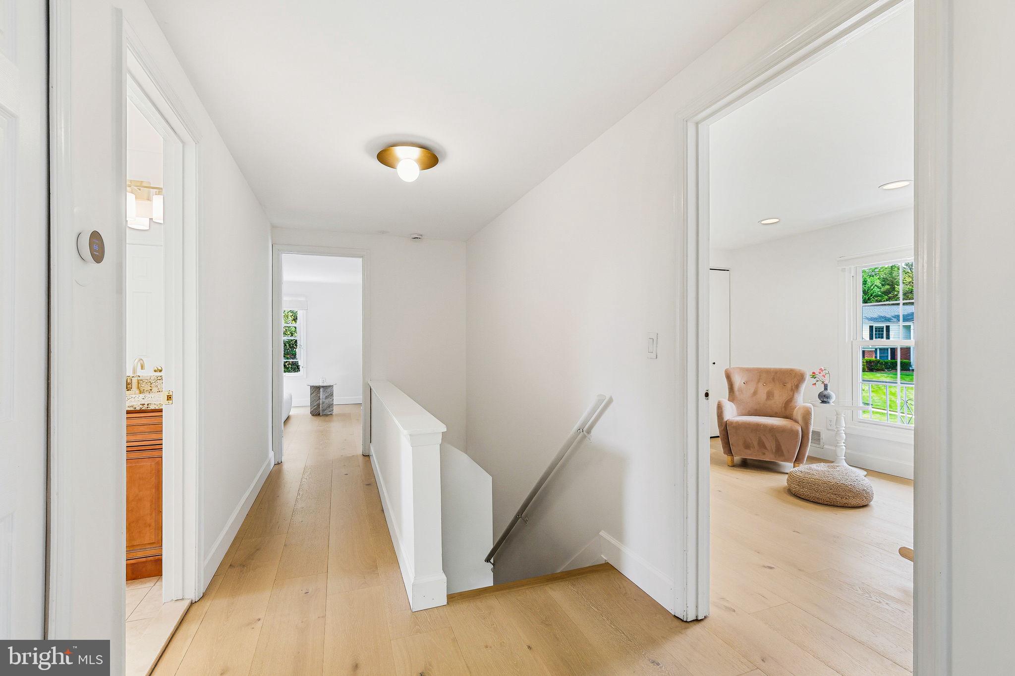 10900 Gainsborough Road Potomac, MD 20854 - Photo 24 of 44 a view of a hallway view with wooden floor and furniture