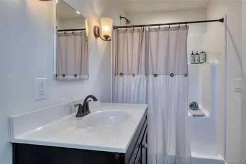 a bathroom with a sink and mirror